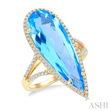 26x9 MM Pear Shape Blue Topaz and 1/3 Ctw Round Cut Diamond Halo Semi-Precious Ring in 14K Yellow Gold