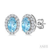 5x3 MM Oval Shape Aquamarine and 1/8 Ctw Round Cut Diamond Halo Semi-Precious Stud Earrings in 14K White Gold