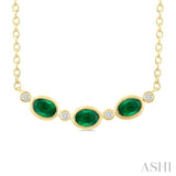 4X3 MM Oval Cut Emerald and 1/50 Ctw Bezel Set Round Cut Diamond Precious Fashion Necklace in 10K Yellow Gold