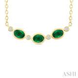 4X3 MM Oval Cut Emerald and 1/50 Ctw Bezel Set Round Cut Diamond Precious Fashion Necklace in 10K Yellow Gold