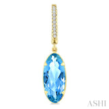 14X6 MM Oval Shape Blue Topaz and 1/10 Ctw Round Cut Diamond Semi-Precious Earrings in 14K Yellow Gold