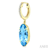 14X6 MM Oval Shape Blue Topaz and 1/10 Ctw Round Cut Diamond Semi-Precious Earrings in 14K Yellow Gold